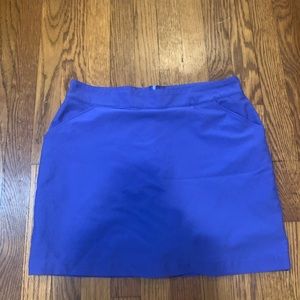 Look cute on the golf course with this Tommy Armour blue skirt with shorts.